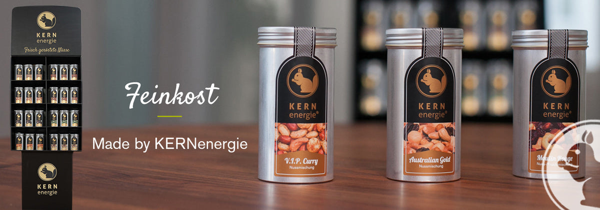 Feinkost-Snacks für den Feinkosthandel – hochwertige Nüsse, Schokolade und kleine Genussartikel, stilvoll verpackt, ideal für Kunden, Geschenksets oder als Gourmetartikel.
